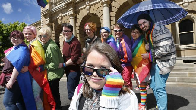 Rachael Kaye, of Lutana, front, is among the colourful crowd at the TasPride Festival launch at the Hobart Town Hall. Picture: KIM EISZELE