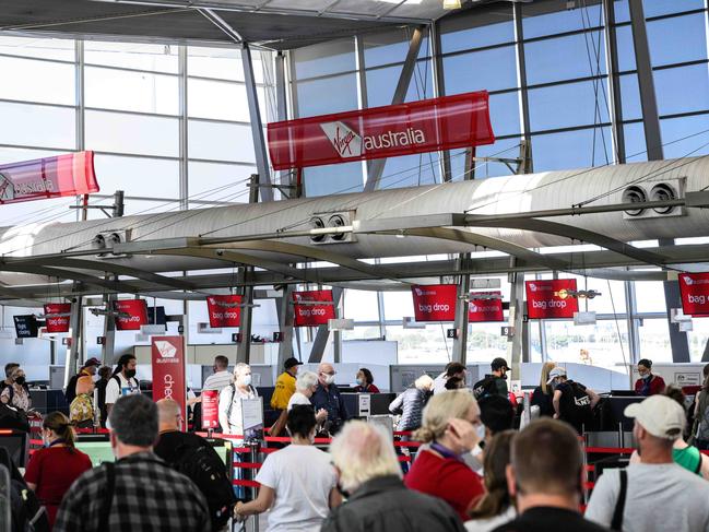 SYDNEY, AUSTRALIA - NewsWire Photos April 11, 2021: People queuing to check in for flights at Sydney Domestic Airport. Picture: NCA NewsWire / James Gourley