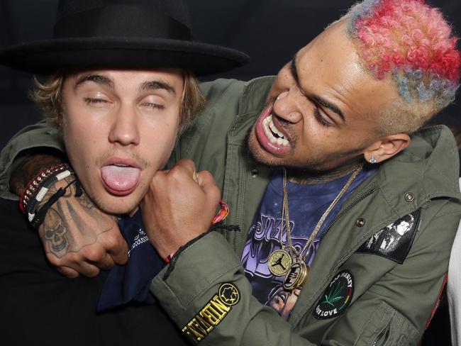 Father figure ... Was Chris Brown trying to teach Justin Bieber a lesson here at Coachella. Picture: Getty