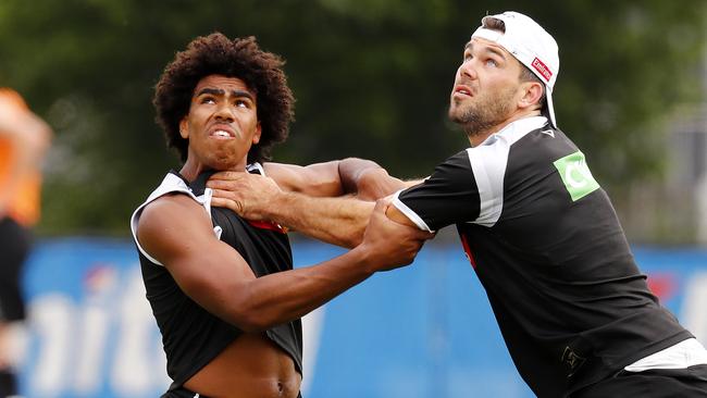 Isaac Quaynor competes with Levi Greenwood at Collingwood training late last year. Pic: Michael Klein