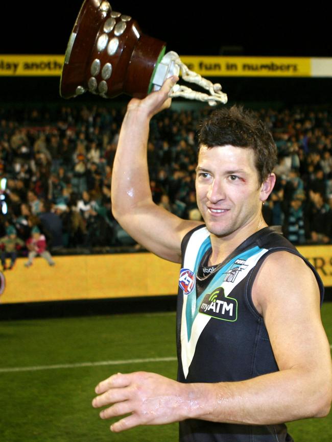 Josh Carr, who never lost a Showdown, with the trophy in his last game for Port Adelaide.