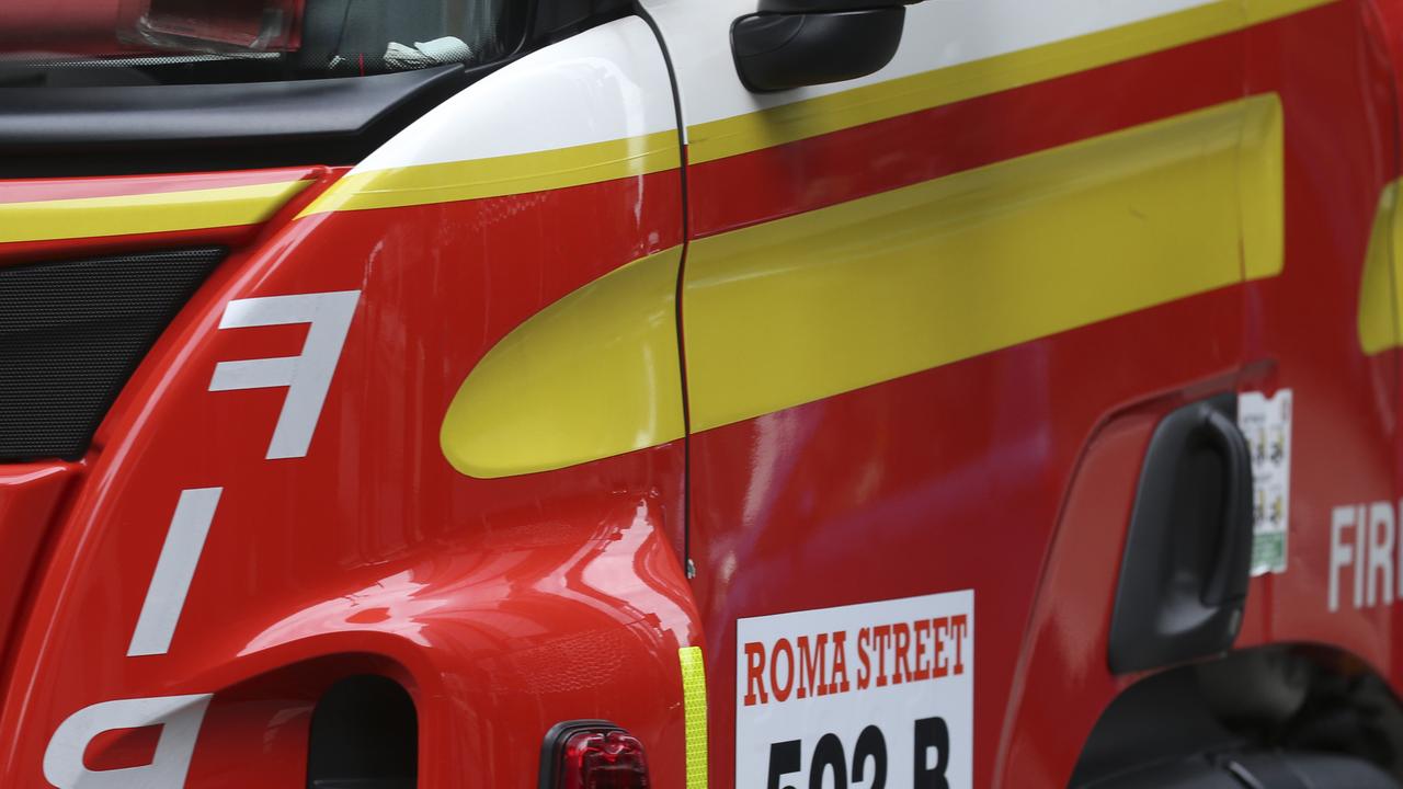 Road closed as crews battle house fire