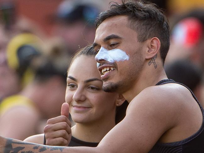 Richmond training at the Punt road Oval. The girls and the men training together in front of the fans.Monique Conti sits behind her boyfriend Sydney Stack in the team shot.Picture Jay Town