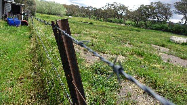 A fence surrounding the property of Mike and Sharon.