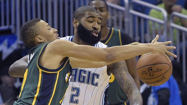 Orlando Magic forward Kyle O'Quinn knocks the ball away from Utah Jazz guard Dante Exum.