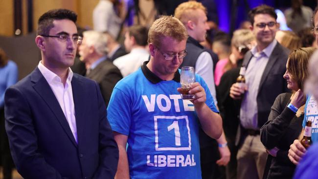 Despondent Liberal supporters at the 2022 Liberal Party election night function at the Fullerton Hotel in Sydney after Scott Morrison conceded defeat. Picture: Nigel Hallett