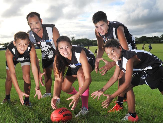 Then-Palmerston captain Lateesha Jeffrey before the NTFL Women’s Round back in 2014. She is pictured with her four brothers Julian, Joel, Jordan and Jai. Picture: Katrina Bridgeford