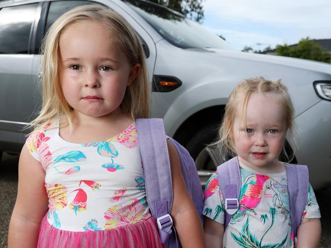 HOLD COURIER MAIL SUNDAY FOR MONDAY 20TH JAN Sophie Bruce, 4, Rothwell, with her sister sister Mollie, 2. Sophie was left behind on a child care bus and is still scared everytime she gets in a car that she may be left behind. Photographer: Liam Kidston.