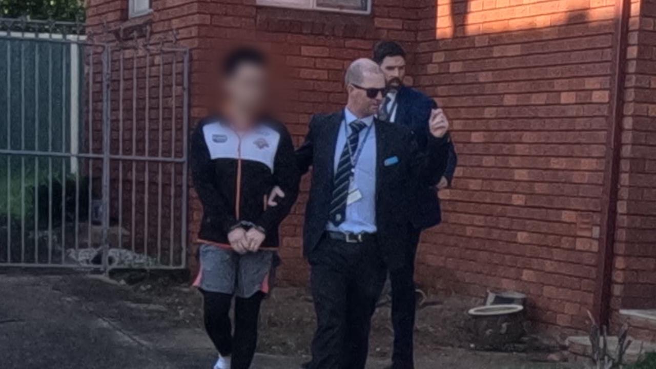 The 41-year-old author, now identified as Oliver Phommavanh, was arrested by detectives from the State Crime Command’s Sex Crimes Squad at an Old Guildford home on Friday. Picture: Supplied / NSW Police