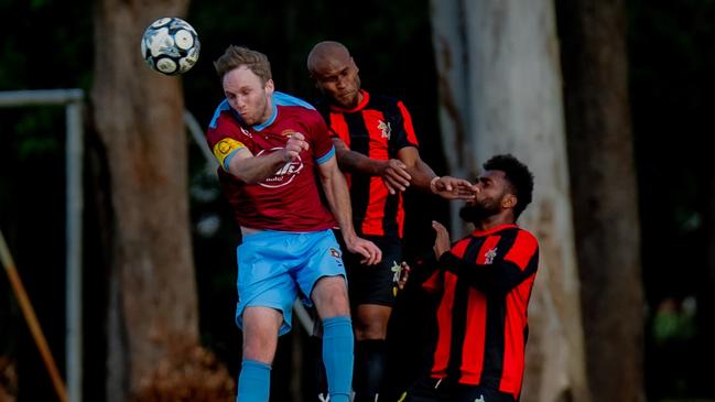 St Albans Captain Dominick Woodland and Gattonâs Fred Farui challenge for a header. Picture: DSL Photography