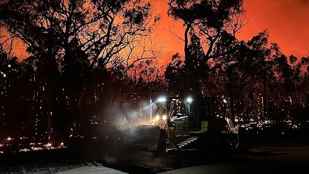 Morley's Earthmoving excavator creating a containment line for the fire brigade in Cranbrook. Photo: Tom Warren