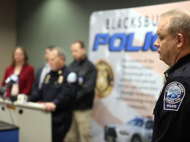 Blacksburg police Lieutenant Mike Albert, right, listens as Blacksburg Police Chief Anthony Wilson speak during a news conference. Picture: Matt Gentry/The Roanoke Times via AP