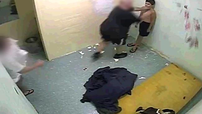 A young boy is held by his neck by a guard in a NT youth detention centre, according to an explosive Four Corners report. Picture: ABC TV