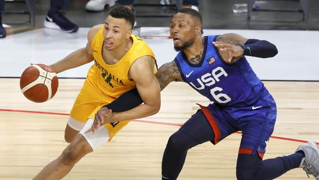 LAS VEGAS, NEVADA - JULY 12:  Dante Exum #11 of the Australia Boomers drives against Damian Lillard #6 of the United States during an exhibition game at Michelob Ultra Arena ahead of the Tokyo Olympic Games on July 12, 2021 in Las Vegas, Nevada. Australia defeated the United States 91-83.  (Photo by Ethan Miller/Getty Images)