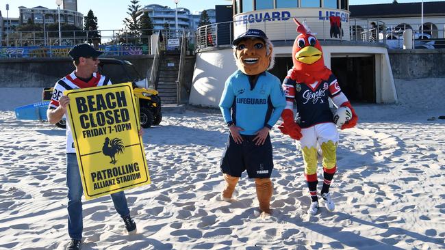 Bondi lifeguards doing their bit to promote the Roosters clash. Photo: Grant Trouville