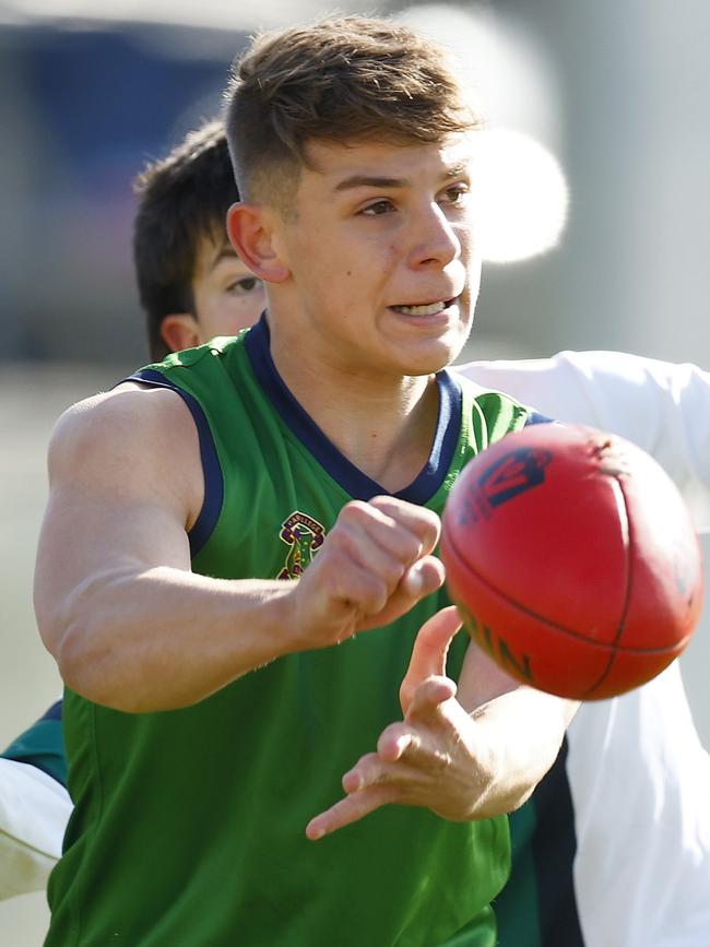 Kristian Lawson of Parade College handballs under pressure. Picture: Daniel Pockett/AFL Photos/via Getty Images