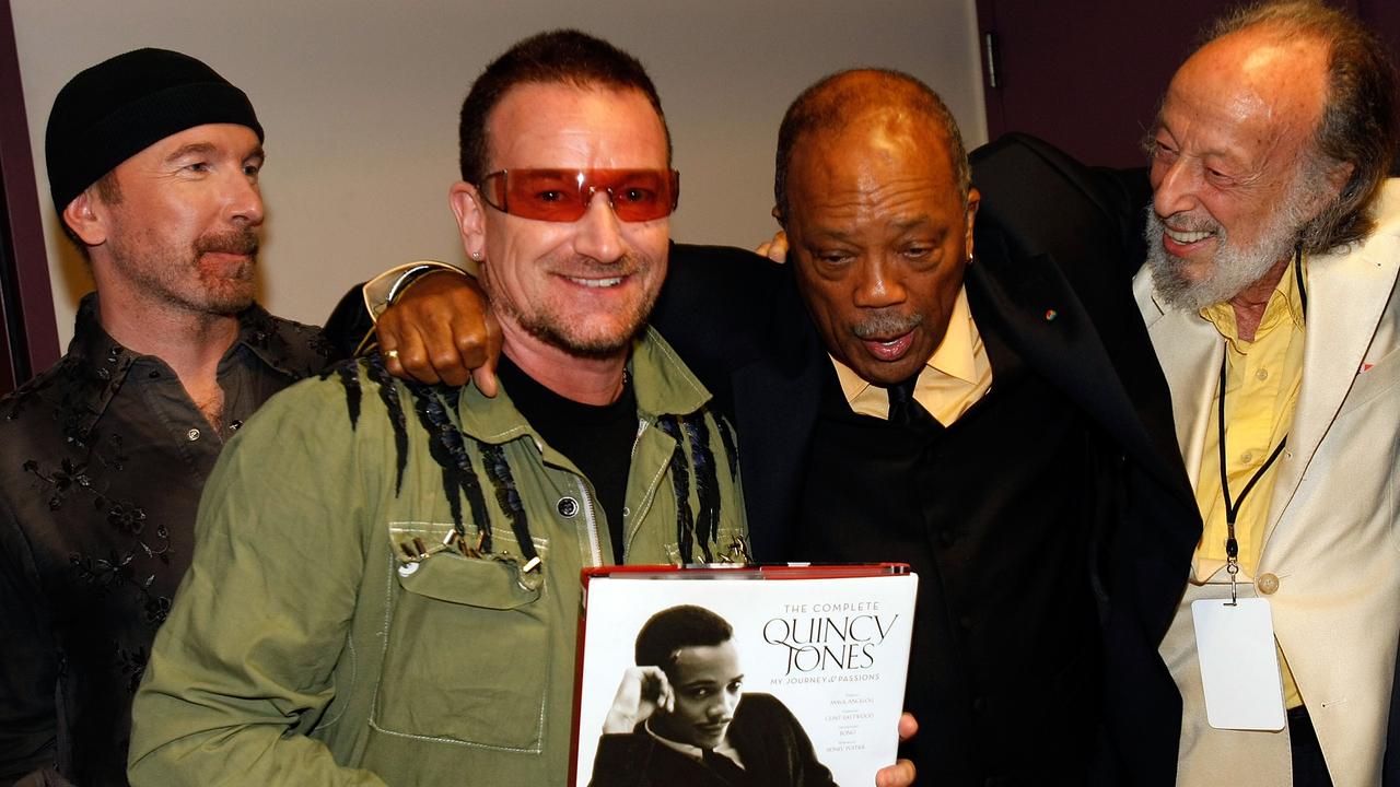 Quincy Jones with Bono and the Edge from U2 and photographer Herman Leonard in 2008. Picture: Getty Images