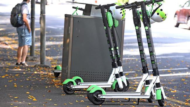 Lime Scooters left on the footpath on Alice St, Brisbane. The scooters are being trialled in the city. Picture: AAP/John Gass