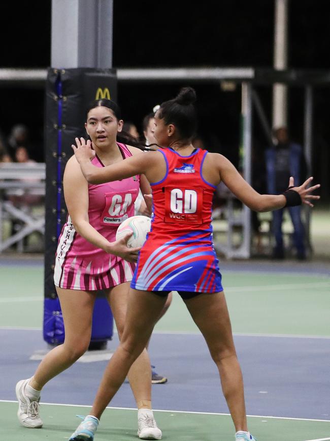 Chantelle Tikitau is guarded by Michaela Kadlecek in the Cairns Netball match between Leprechauns and Sharks. PICTURE: BRENDAN RADKE