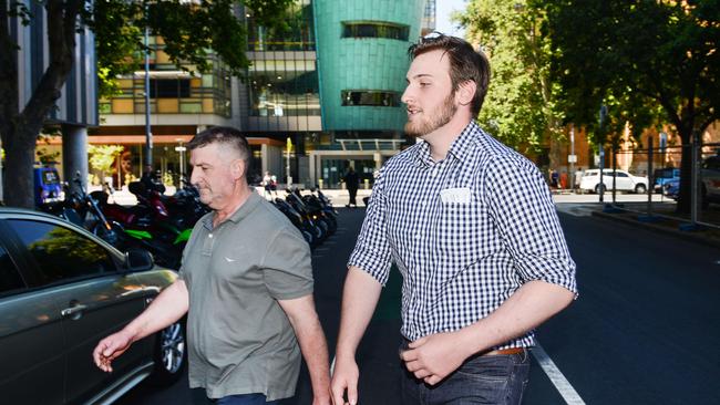 Marcus Cappo (right) with his father Cappo Seafoods Co-director Matthew Cappo. Marcus is facing child sexual exploitation charges in the Adelaide Magistrates Court. Picture: NCA NewsWire / Brenton Edwards