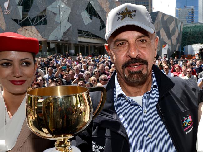 Melbourne cup press conference featuring 2013 Emirates Melbourne Cup trainers and jockeys. A very confident  Dr Marwan Koukash owner of Mount Athos holds the Cup after the Press conference.