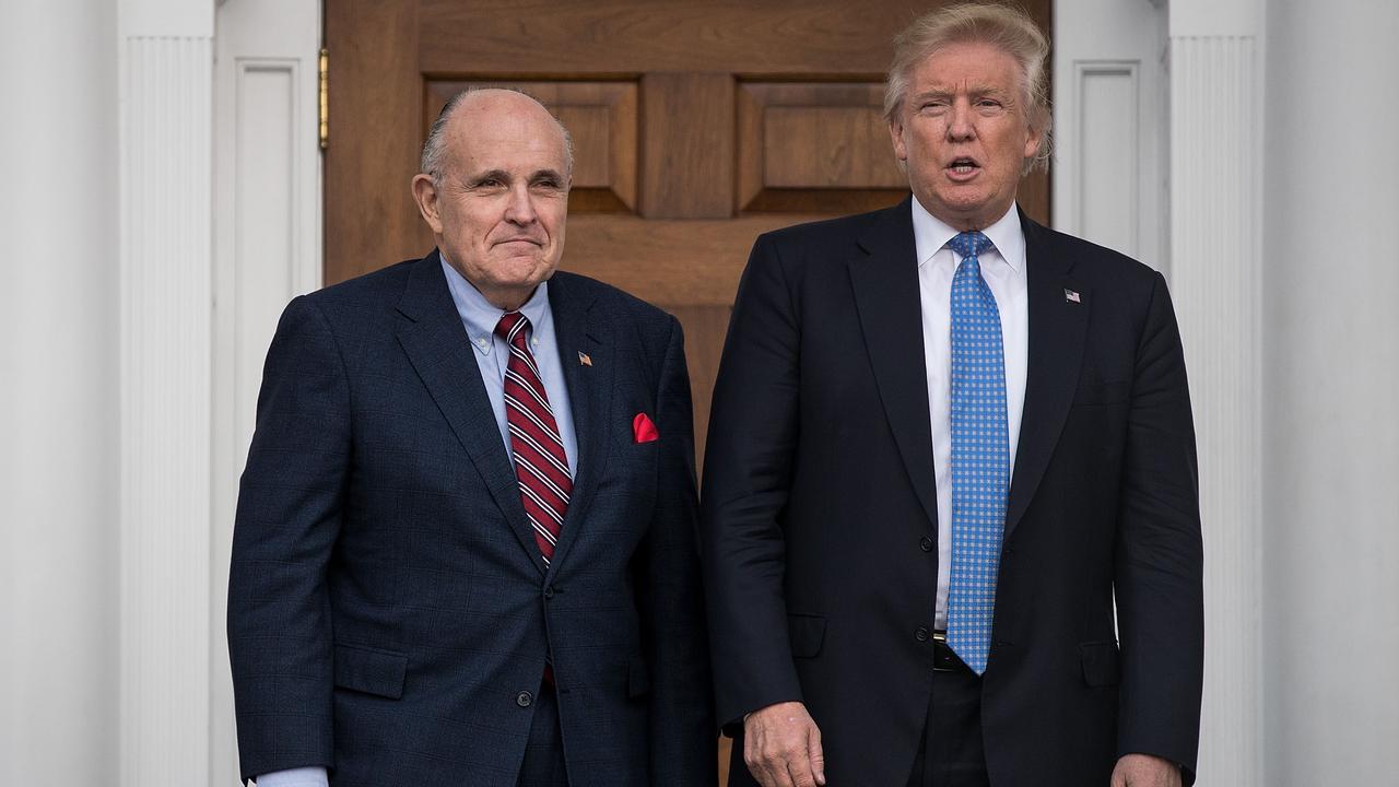 In November 2016, Rudy Giuliani with president-elect Donald Trump at Trump International Golf Club. Picture: Drew Angerer/Getty Images