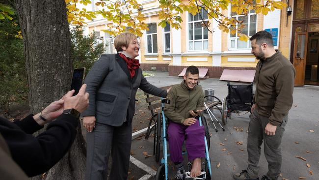 Ukrainian President Volodymyr Zelenskyy talking to a wounded serviceman during his visit to a military hospital in Kyiv, as the country marks Defenders Day. Picture: AFP