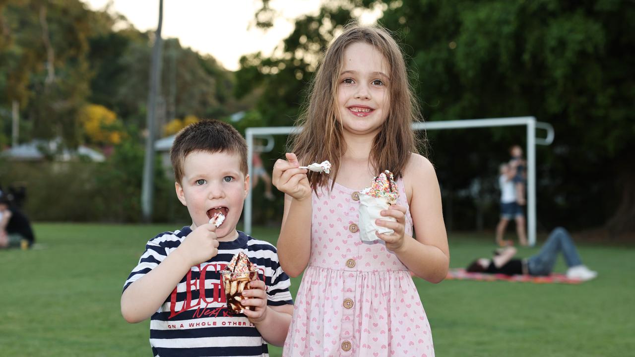 Edward Housley, 4, and Alexandra Housley, 6, enjoy an icecream sundae at the Barron River Food Festival, held at the Stratford Dolphins Football Club. Picture: Brendan Radke