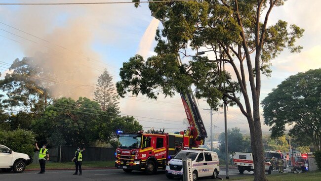 A special fire crane was used to get over the top of the burning building on Plantain Rd, Shailer Park on Monday. PHOTO: Jeni Faulkner