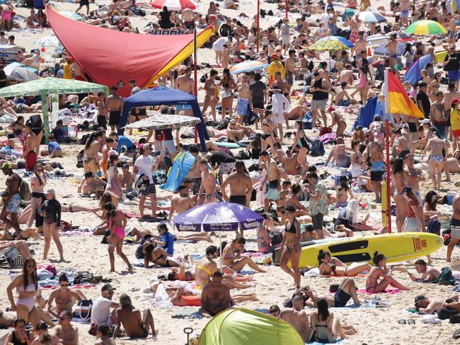 SYDNEY, AUSTRALIA - NewsWire Photos OCTOBER 05, 2020 - Huge crowds flocked to Coogee Beach on Monday October 05, 2020 as temperatures reached 30 degrees. Picture: NCA NewsWire / Christian Gilles