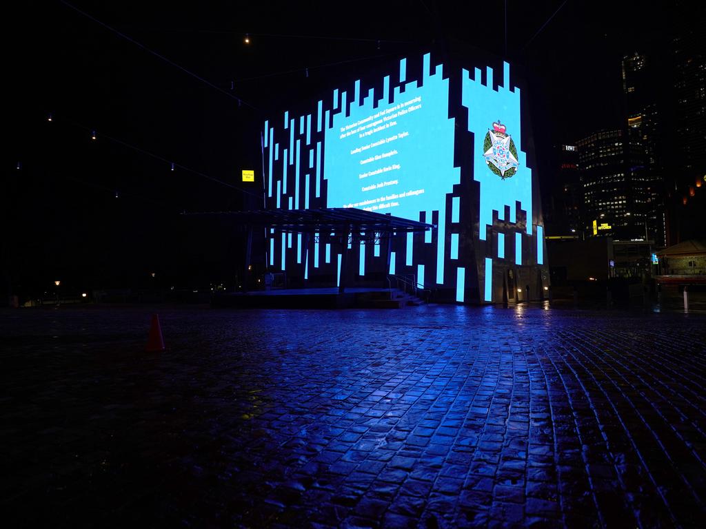Federation Square is lit up in blue colour. Picture: Michael Dodge/AAP