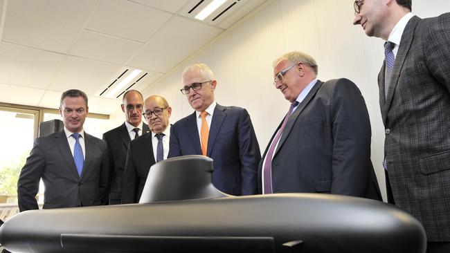 Then prime minister Malcolm Turnbull with French and Australian defence figures after the formal submarine contract signing in 2016. Picture: AAP