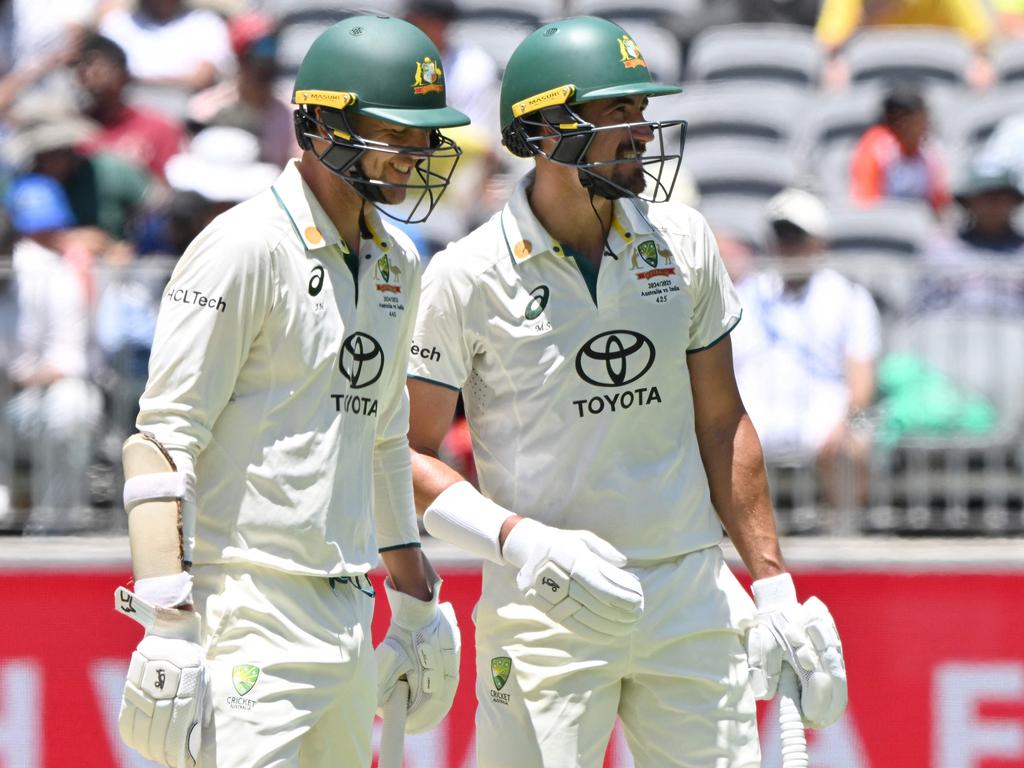 Josh Hazlewood (left) finished not out 7 in a team-high 25-run stand with Starc. (Photo by SAEED KHAN/AFP)