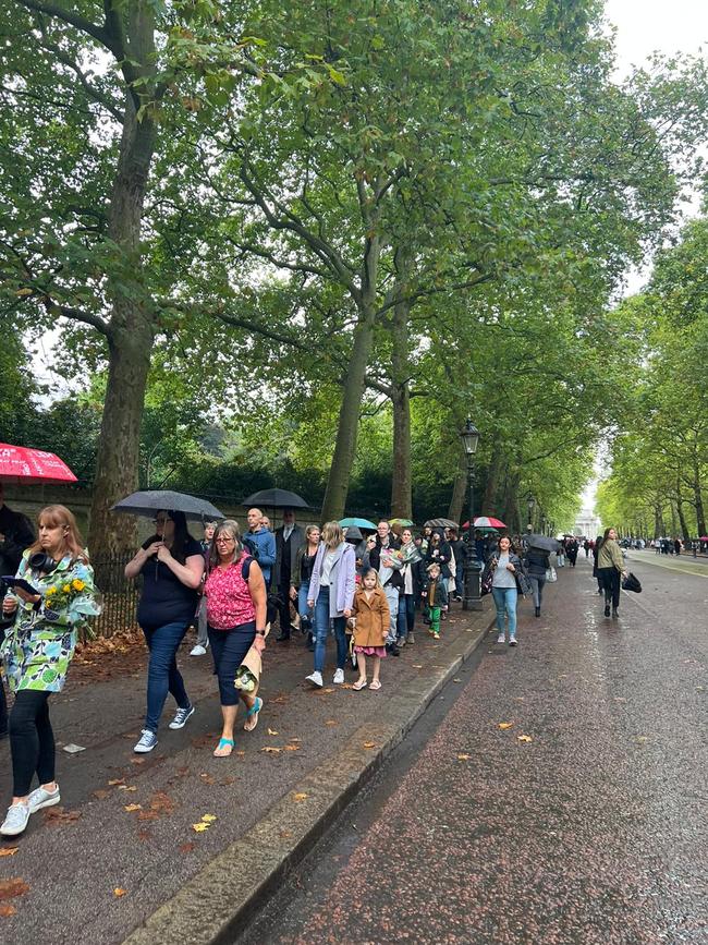 Despite the rain, people still want to pay their respects.