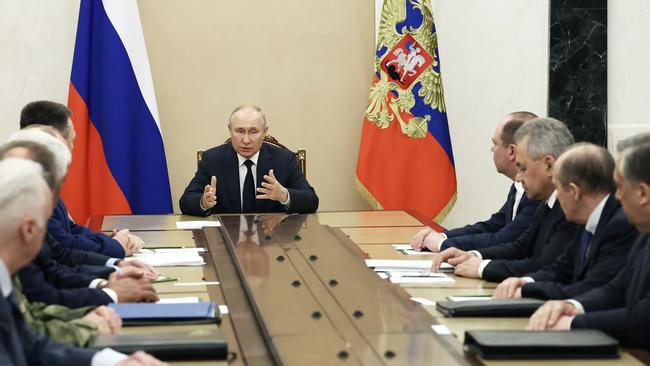 Russian President Vladimir Putin with the country's top security officials in Moscow on Monday. Picture: AFP