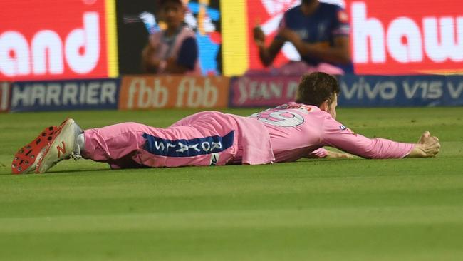 Steve Smith lies prone after taking a catch to dismiss David Warner in the IPL. Picture: Money Sharma/AFP