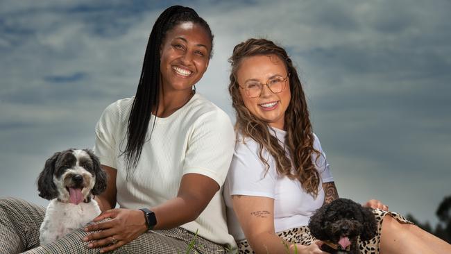 Frederick has finally realised her dream to settle in Melbourne, with her partner Lili Cadee-Matthews with their dogs Arlo (left) and Jezi (right). Picture: Tony Gough.