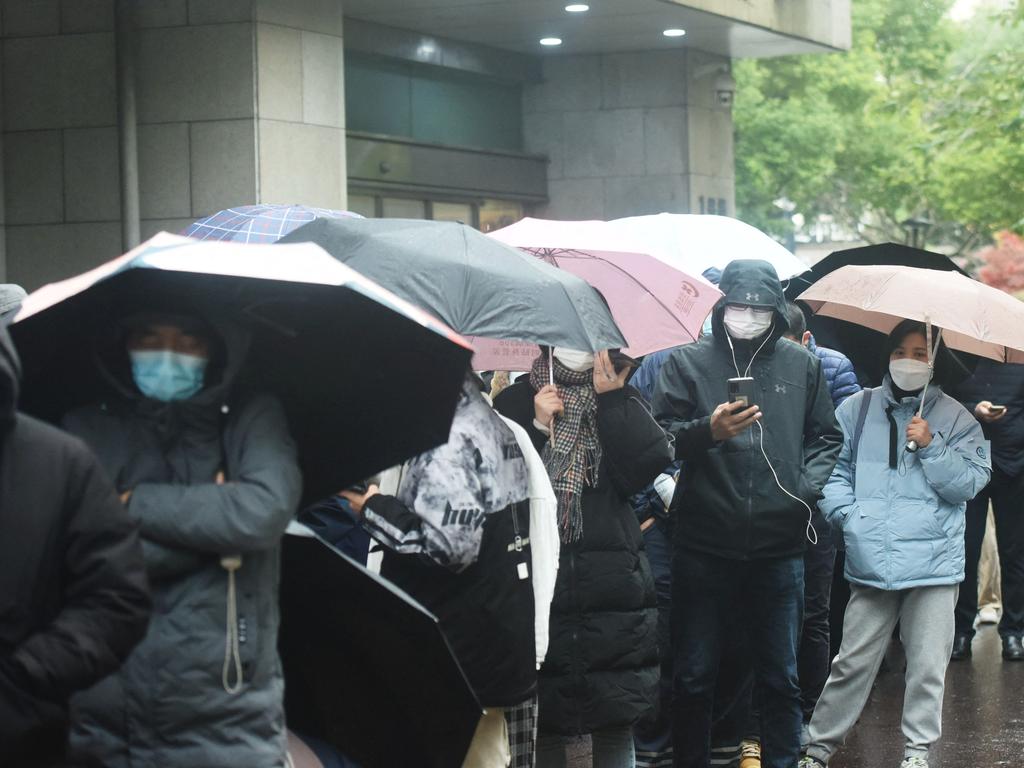 People queue to be tested for Covid-19 outside a hospital in Hangzhou, in Zhejiang province. Mandatory testing has ended, sparking a huge wave of infections. Picture: AFP