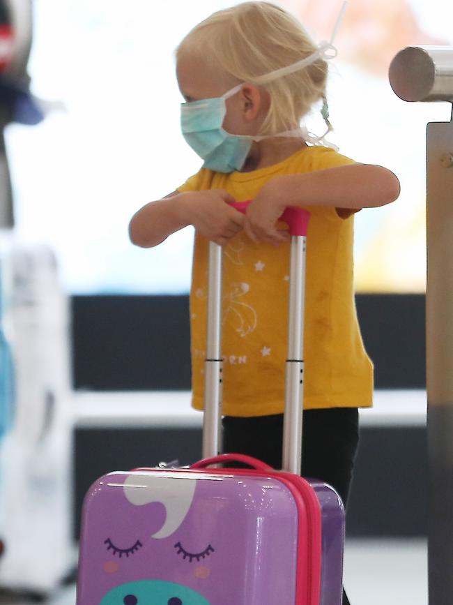 A little passenger stays safe at Sydney Airport.