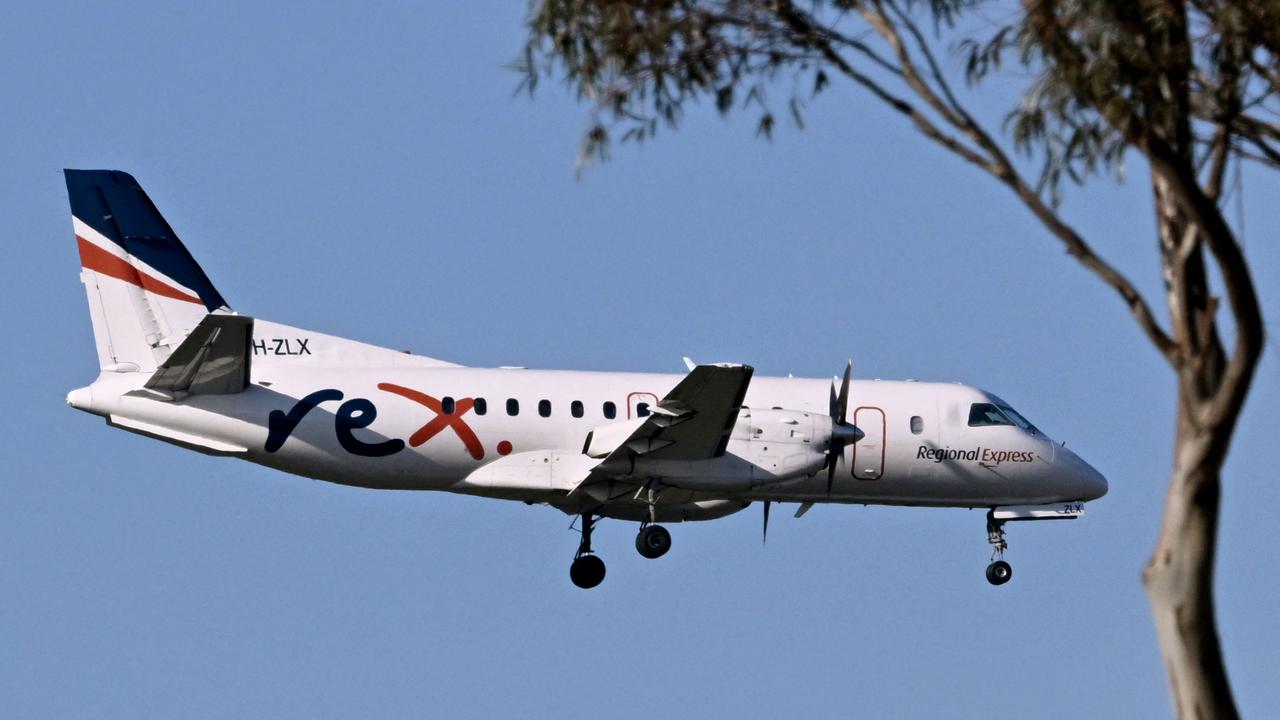 A Rex Airlines Saab 340B prepares to land at Melbourne's Tullamarine Airport on Tuesday. Townsville Airport confirmed on Wednesday that regional Rex flights were still operating although flights between major cities using the Boeing 737 had been scrapped due to financial difficulties. Picture: William West-AFP