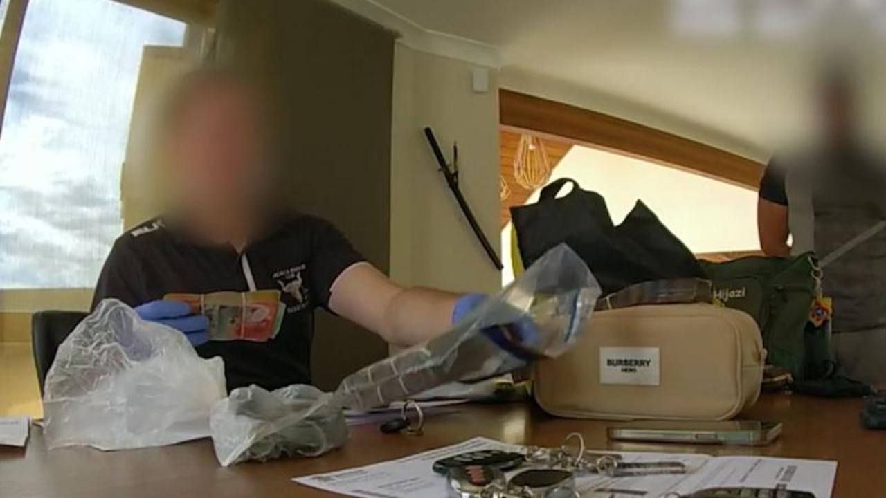 Police raid the home of one of the members of an alleged car scam. Picture: Supplied