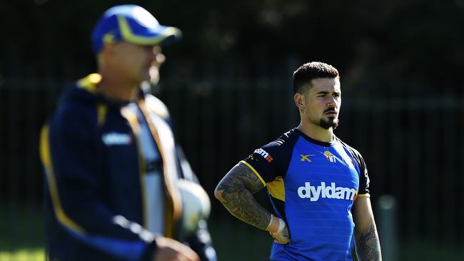 Nathan Peats with coach Brad Arthur in the foreground during Parramatta training this morning. Picture: Brett Costello