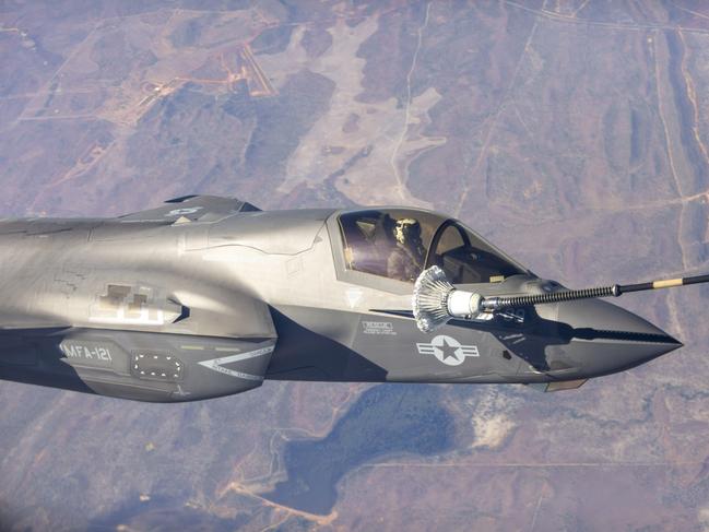 An US Marine F35 jet refuelling mid-air while travelling about 800km/h about 100km south of Darwin. Picture: Floss Adams.