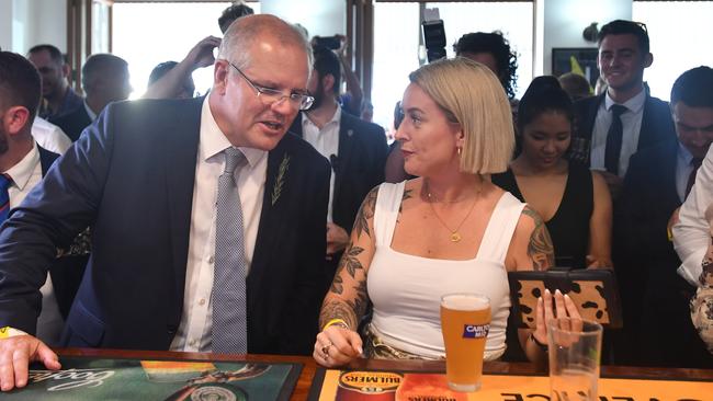 Scott Morrison at the bar at the Australian Hotel in Townsville. Picture: AAP