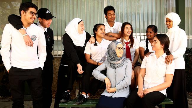 Holroyd high school teacher Nila Sayeed (centre) with students. Nila appeared in a video by the Department of Education, with some of her students, about her journey from being a refugee to a science teacher. Picture: Justin Sanson.