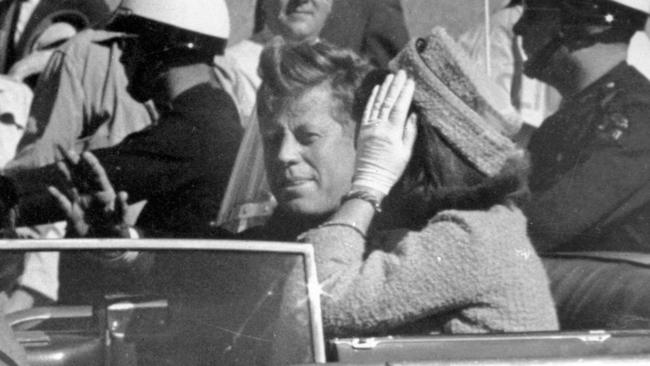 President John F. Kennedy waves from his car in a motorcade in Dallas, riding alongside First Lady Jacqueline Kennedy. Picture: AP Photo/Jim Altgens, File