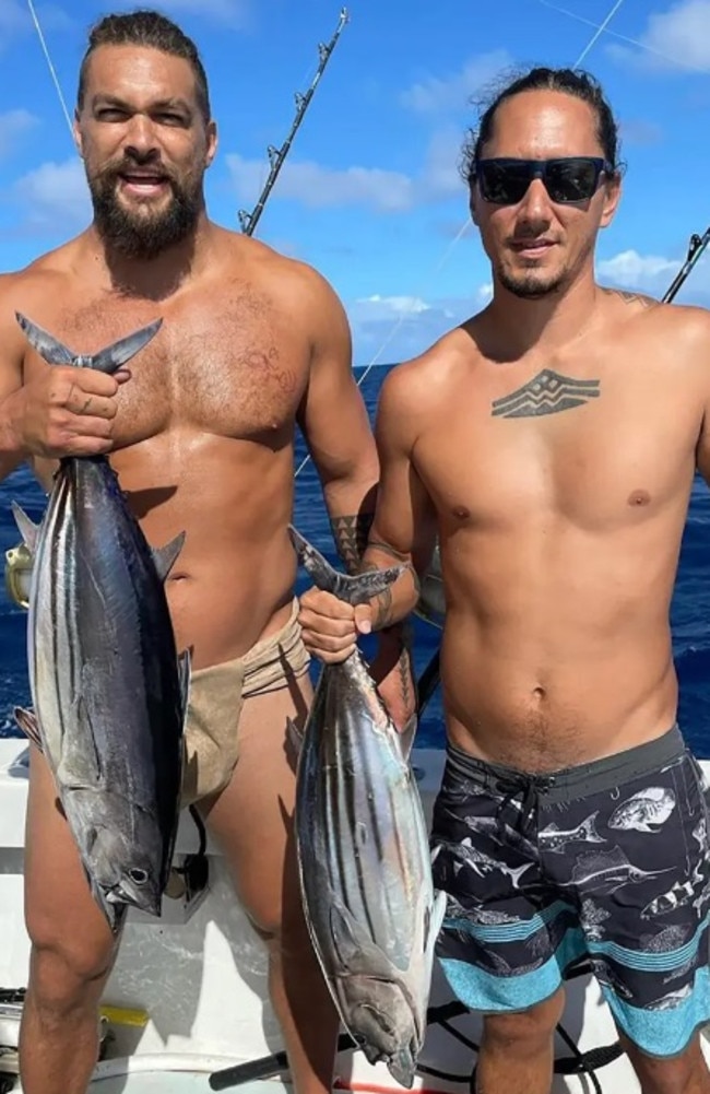 He posed with his friend and their catches of the day – aku, also known as skipjack tuna. Picture: Instagram