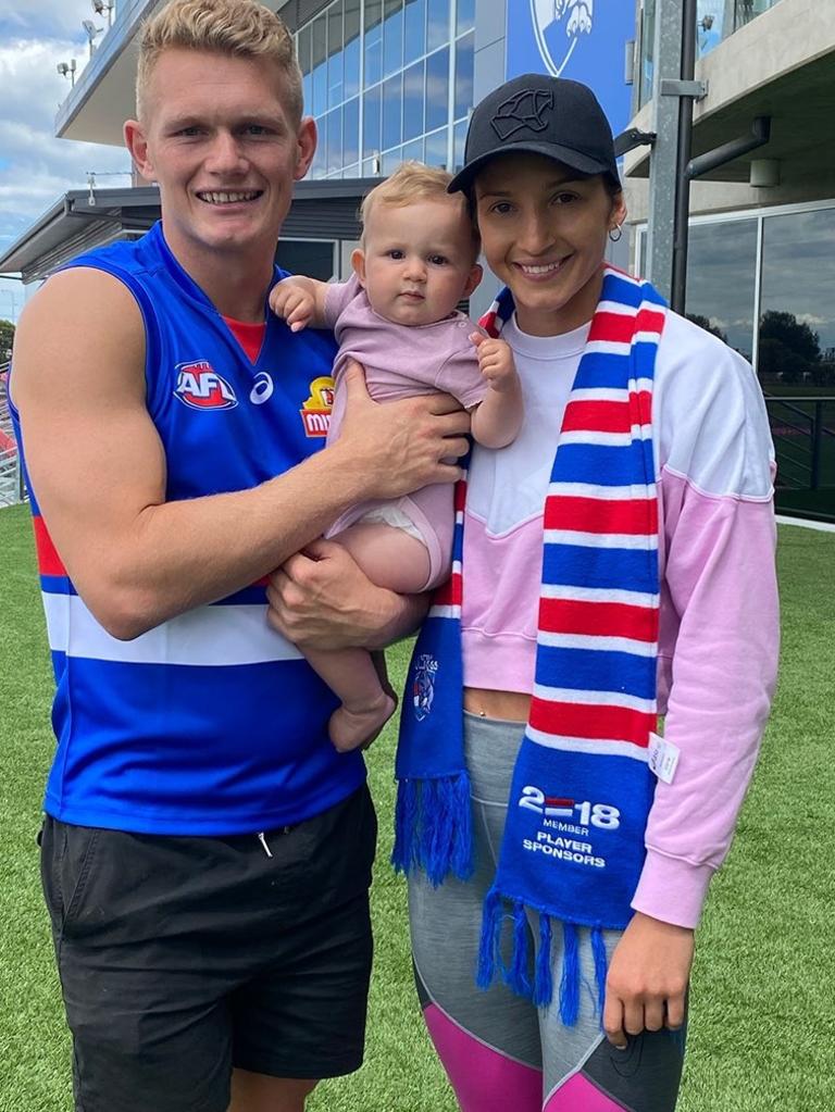 Adam Treloar, wife Kim Ravallion and daughter Georgie.