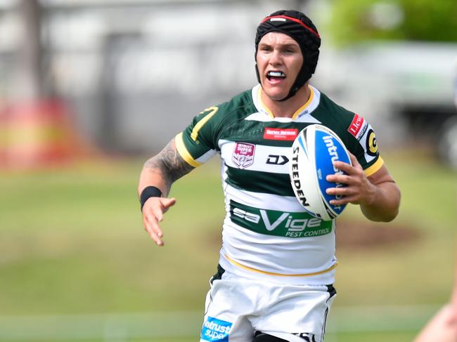 Ipswich Jets five-eight Josh Cleeland, wearing his distinctive headgear, looks to make a decisive run.