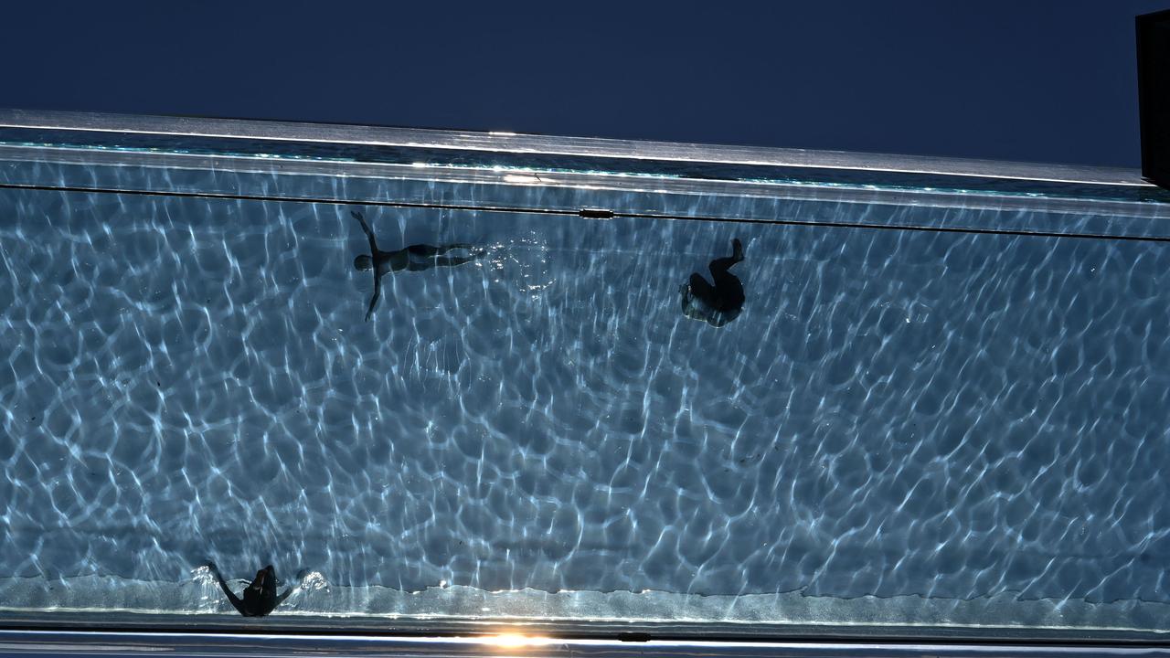 The acrylic swimming pool bridge is fixed between two apartment blocks. Picture: Justin Tallis/AFP